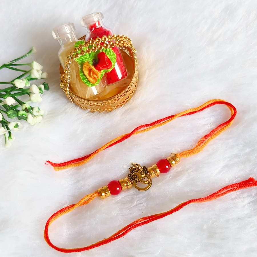 Ganesha Cham Red Beads Rakhi